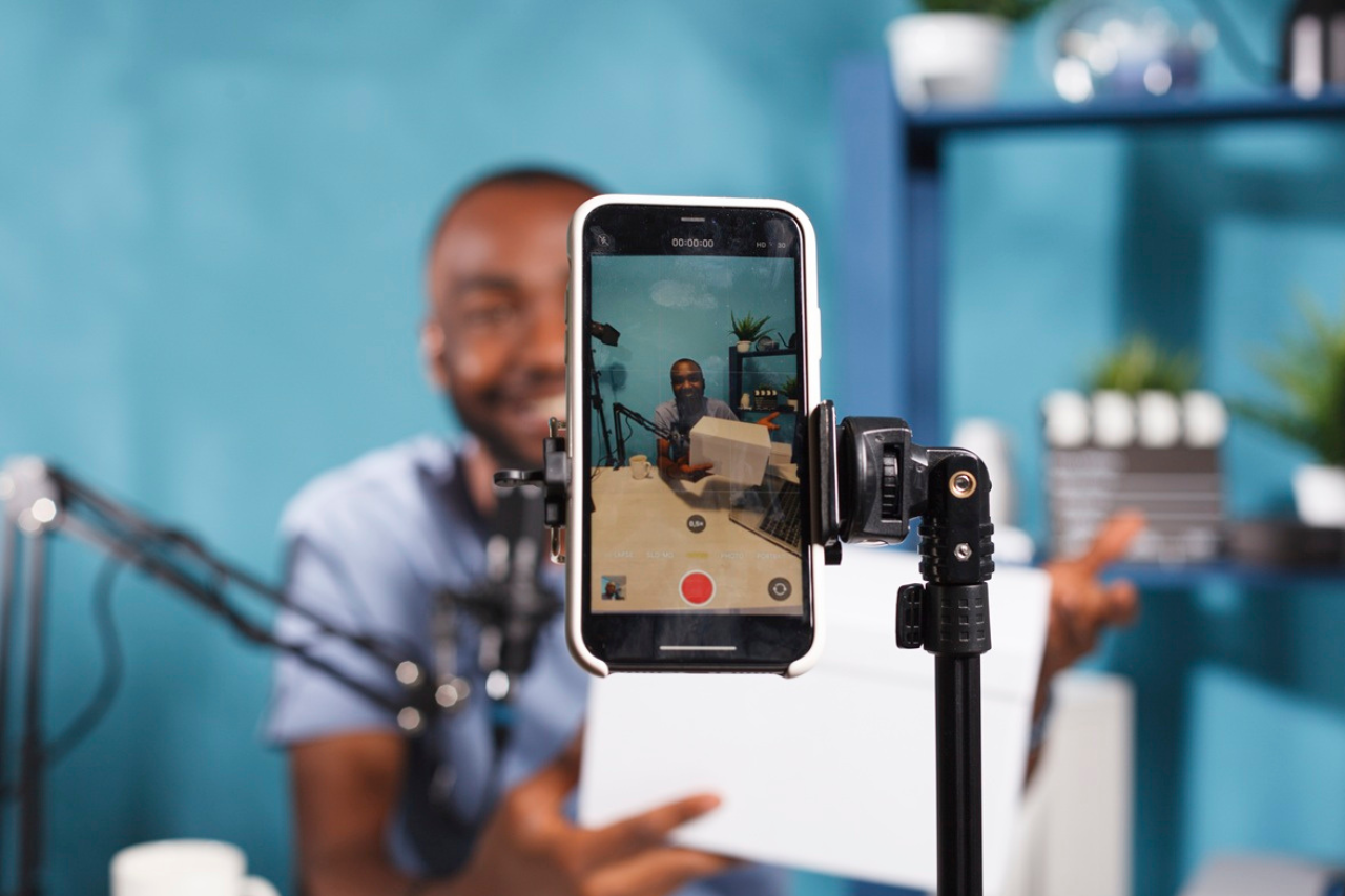 Smartphone gimbal stabilizing video recording for smooth footage